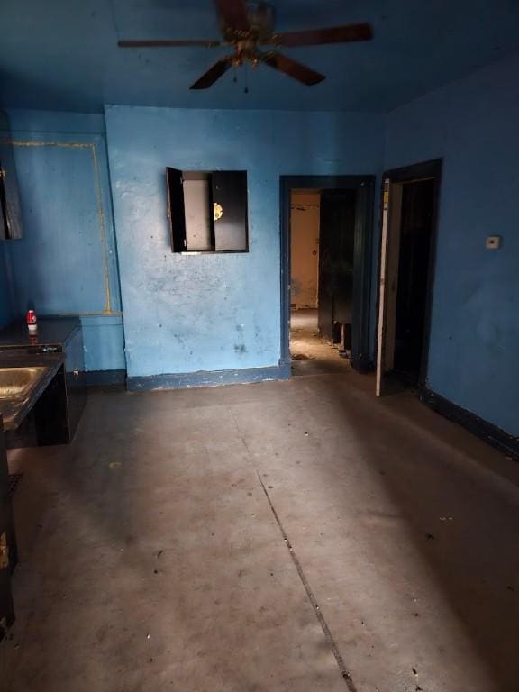 324 Moore Ave, Knoxville, PA 15210 - unfurnished room with a ceiling fan and concrete floors