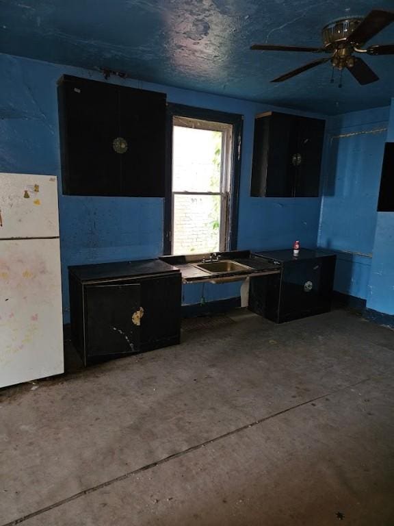 324 Moore Ave, Knoxville, PA 15210 - kitchen with freestanding refrigerator, ceiling fan, and concrete floors