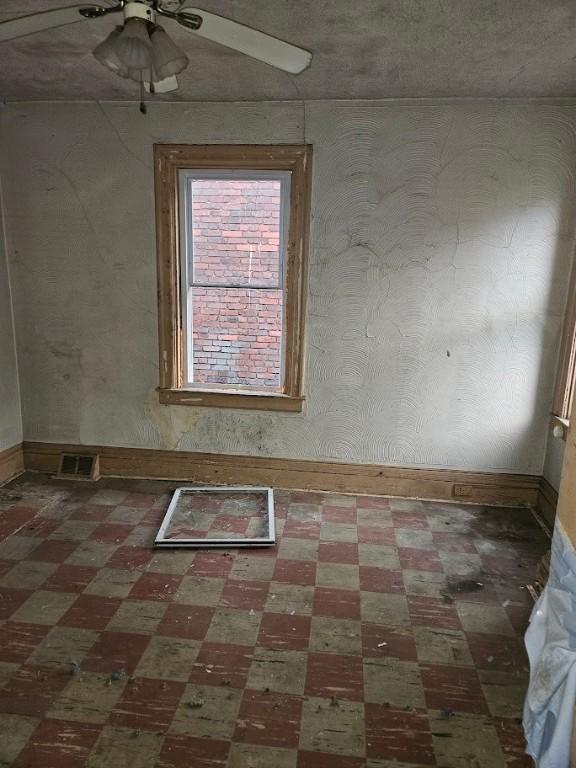 324 Moore Ave, Knoxville, PA 15210 - unfurnished room featuring tile patterned floors and a ceiling fan