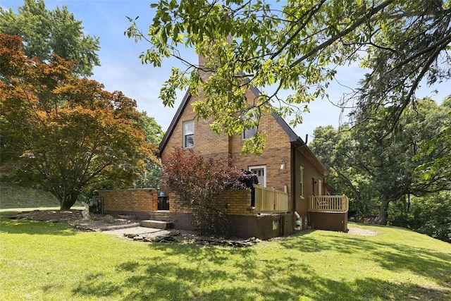 1045 Beverly Ave, Ambridge, PA 15003 - view of property exterior featuring a yard, a chimney, and brick siding