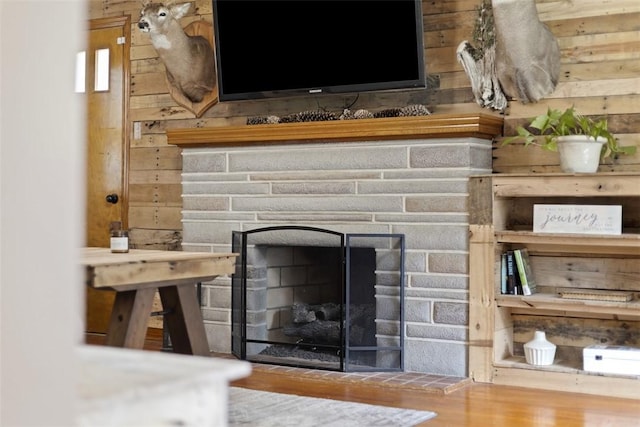 1045 Beverly Ave, Ambridge, PA 15003 - detailed view of wood finished floors, wood walls, and a stone fireplace