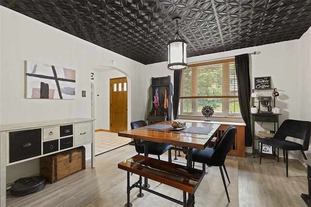 1045 Beverly Ave, Ambridge, PA 15003 - dining area featuring arched walkways, light wood-type flooring, and an ornate ceiling