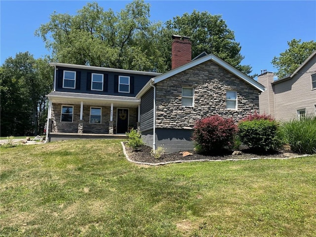 4689 Greenwood Dr, Hampton, PA 15101 - view of front facade with stone siding, a chimney, and a front yard