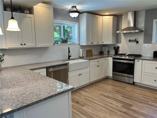 4689 Greenwood Dr, Hampton, PA 15101 - kitchen featuring wall chimney range hood, stainless steel appliances, tasteful backsplash, dark stone counters, and recessed lighting