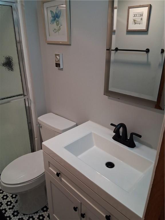 4977 Meadow Park Dr, Whitehall, PA 15236 - bathroom with vanity, an enclosed shower, and tile patterned flooring