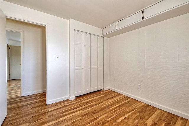511 New Haven Dr, Hempfield Twp, PA 15601 - unfurnished bedroom featuring light wood-style floors and a closet