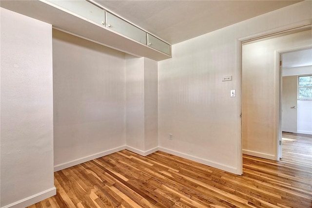 511 New Haven Dr, Hempfield Twp, PA 15601 - empty room with wood finished floors and baseboards