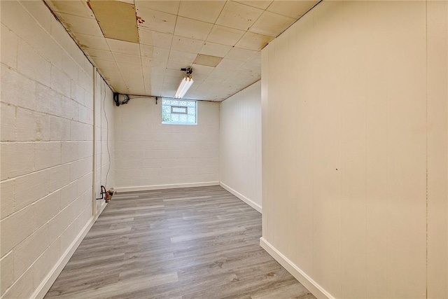 511 New Haven Dr, Hempfield Twp, PA 15601 - basement with wood finished floors and concrete block wall