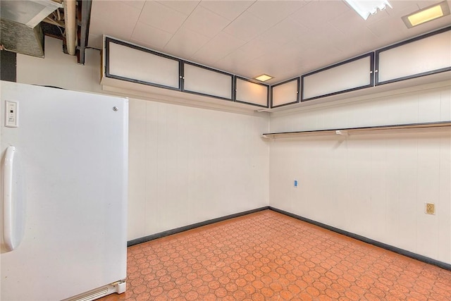 511 New Haven Dr, Hempfield Twp, PA 15601 - garage with freestanding refrigerator and baseboards