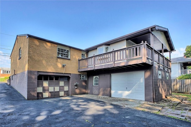 511 New Haven Dr, Hempfield Twp, PA 15601 - rear view of house with a garage, driveway, and a balcony