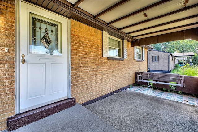 511 New Haven Dr, Hempfield Twp, PA 15601 - doorway to property featuring brick siding