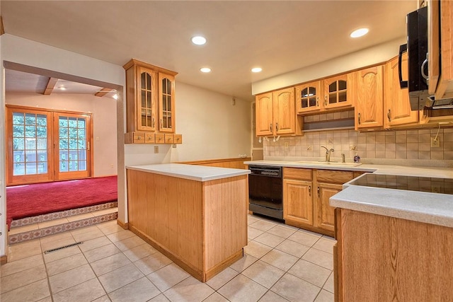 511 New Haven Dr, Hempfield Twp, PA 15601 - kitchen with black appliances, light tile patterned flooring, light countertops, decorative backsplash, and recessed lighting