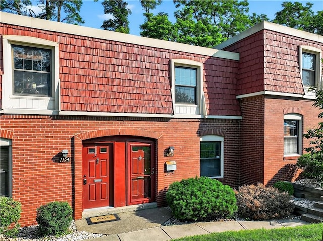 1152 Pennsbury Blvd, Pennsbury, PA 15205 - townhome / multi-family property featuring brick siding and mansard roof