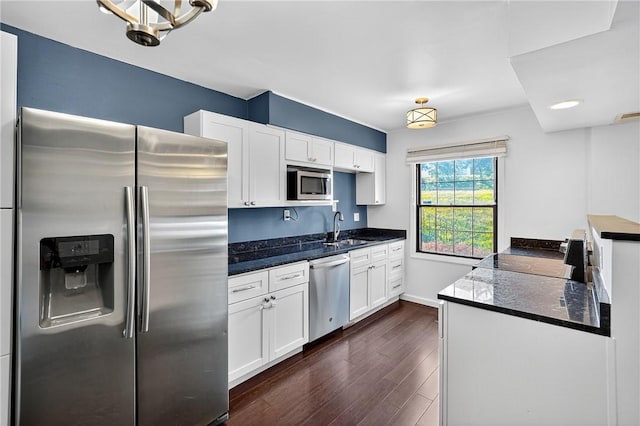 1152 Pennsbury Blvd, Pennsbury, PA 15205 - kitchen featuring appliances with stainless steel finishes, dark wood-style flooring, and white cabinetry