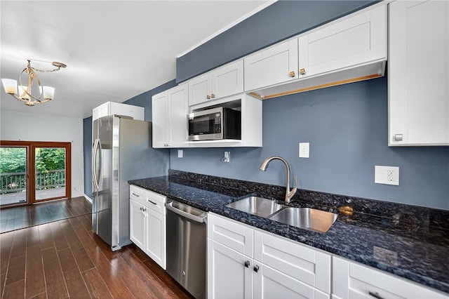 1152 Pennsbury Blvd, Pennsbury, PA 15205 - kitchen featuring stainless steel appliances, white cabinetry, a chandelier, and dark wood-style floors