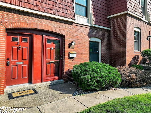 1152 Pennsbury Blvd, Pennsbury, PA 15205 - property entrance with brick siding and mansard roof
