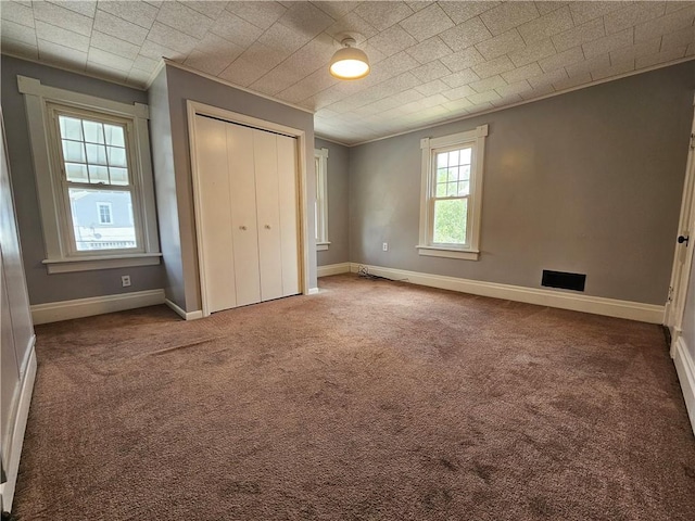 1908 6th Ave, Beaver Falls, PA 15010 - unfurnished bedroom featuring ornamental molding, carpet, and a closet