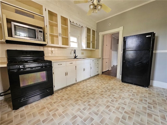 1908 6th Ave, Beaver Falls, PA 15010 - kitchen with black appliances, light countertops, tasteful backsplash, and ornamental molding