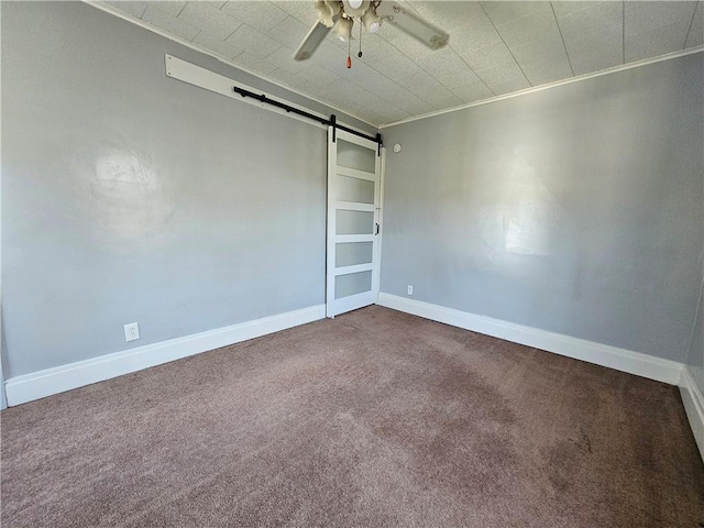 1908 6th Ave, Beaver Falls, PA 15010 - empty room featuring a barn door, dark carpet, ceiling fan, and ornamental molding
