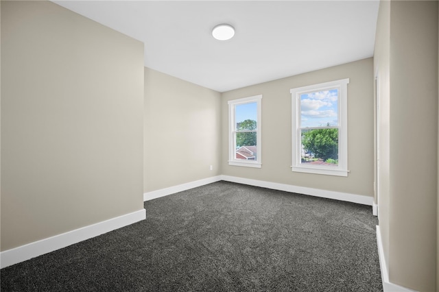 1317 Indiana Ave, Monaca, PA 15061 - unfurnished room featuring dark colored carpet and baseboards