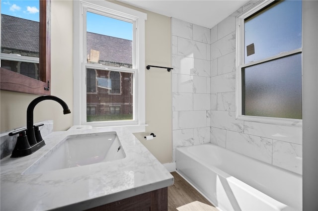 1317 Indiana Ave, Monaca, PA 15061 - full bath with vanity, wood finished floors, and shower / bath combination