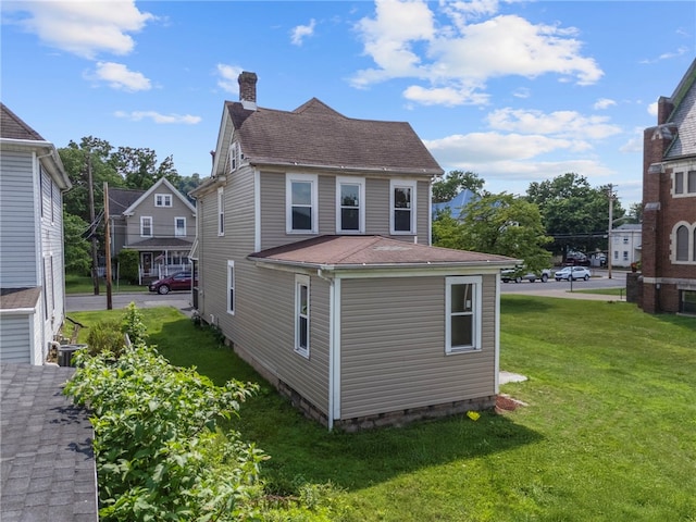 1317 Indiana Ave, Monaca, PA 15061 - view of side of property with a chimney, a lawn, crawl space, and roof with shingles