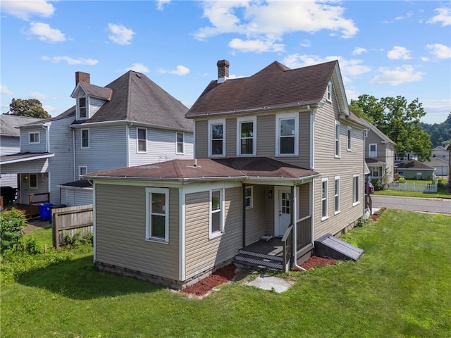 1317 Indiana Ave, Monaca, PA 15061 - back of property with a lawn and a chimney