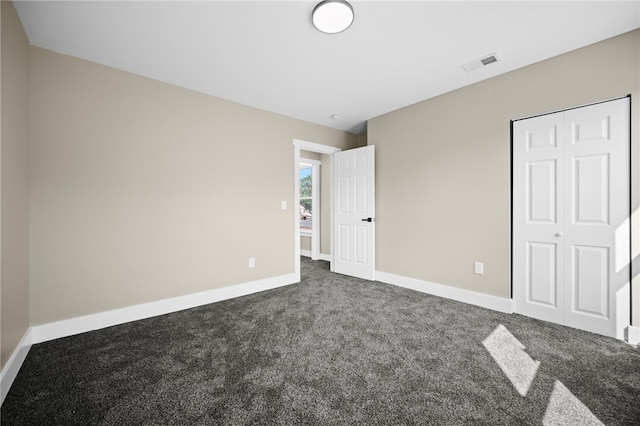 1317 Indiana Ave, Monaca, PA 15061 - unfurnished bedroom featuring dark colored carpet and a closet