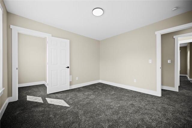 1317 Indiana Ave, Monaca, PA 15061 - unfurnished bedroom with dark colored carpet and baseboards