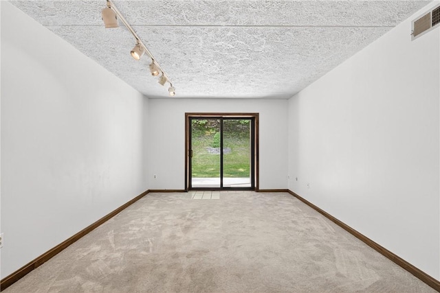 2011 Thornberry Dr, Ross Twp, PA 15237 - carpeted empty room with baseboards and track lighting