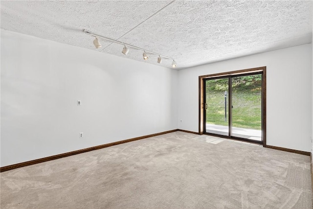 2011 Thornberry Dr, Ross Twp, PA 15237 - unfurnished room featuring light carpet, track lighting, and a textured ceiling