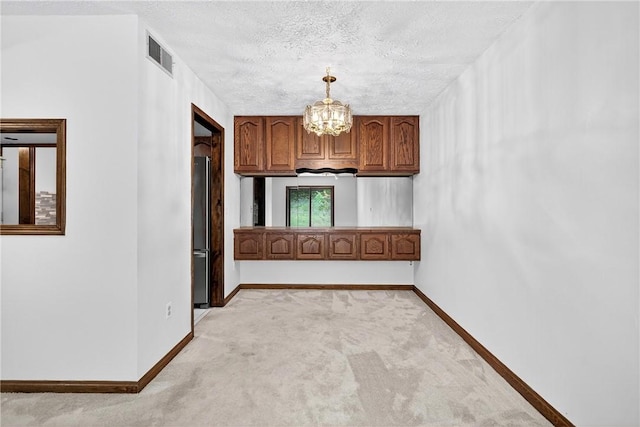 2011 Thornberry Dr, Ross Twp, PA 15237 - corridor featuring light colored carpet, a chandelier, and a textured ceiling