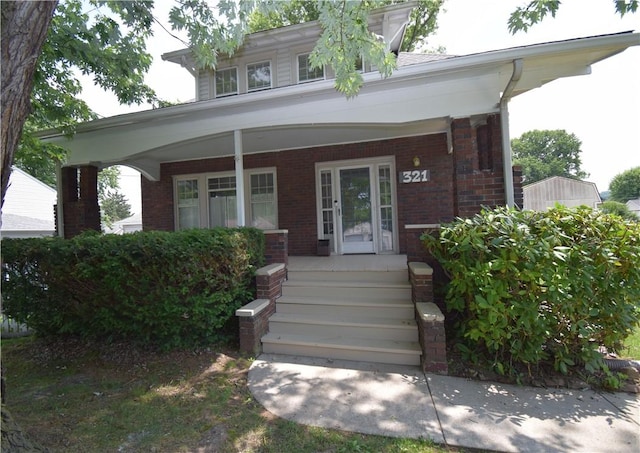 321 Hansen Ave, Franklin Twp, PA 16117 - doorway to property with a porch and brick siding