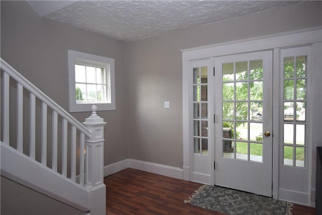 321 Hansen Ave, Franklin Twp, PA 16117 - doorway to outside featuring wood finished floors, stairway, and a textured ceiling