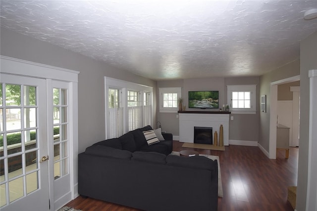 321 Hansen Ave, Franklin Twp, PA 16117 - living room featuring a fireplace with flush hearth, dark wood-style flooring, and a textured ceiling