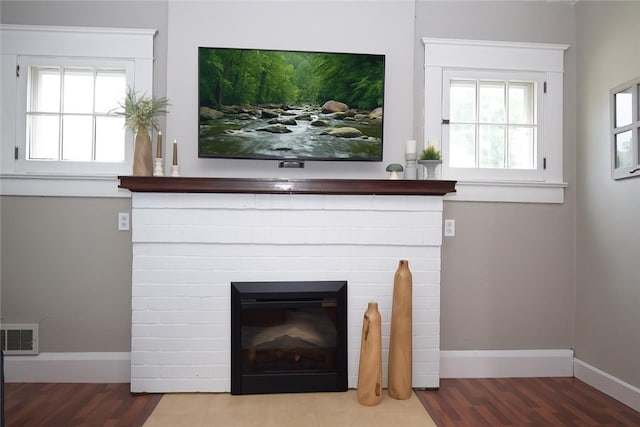 321 Hansen Ave, Franklin Twp, PA 16117 - detailed view of a brick fireplace and wood finished floors