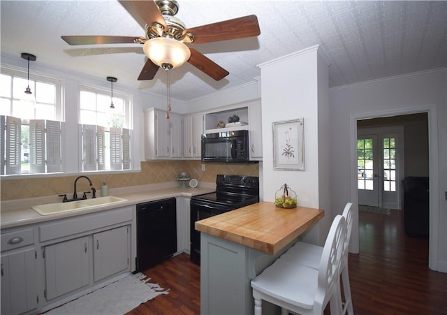 321 Hansen Ave, Franklin Twp, PA 16117 - kitchen with black appliances, dark wood-style flooring, tasteful backsplash, crown molding, and wood counters