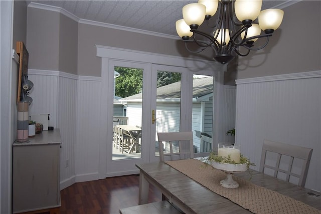 321 Hansen Ave, Franklin Twp, PA 16117 - dining space featuring wood finished floors, a chandelier, a wainscoted wall, and crown molding