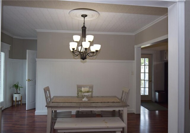 321 Hansen Ave, Franklin Twp, PA 16117 - dining area with dark wood-type flooring, a chandelier, wainscoting, and ornamental molding