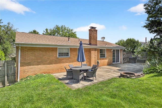 555 Madison St, Mccandless, PA 15237 - rear view of property with brick siding, an outdoor fire pit, a chimney, and a patio area