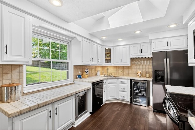 555 Madison St, Mccandless, PA 15237 - kitchen with wine cooler, black appliances, dark wood-type flooring, white cabinetry, and recessed lighting