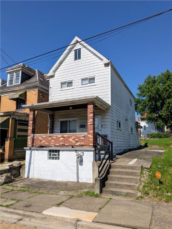 1310 Pirl St, Mckeesport, PA 15132 - view of front of house with brick siding