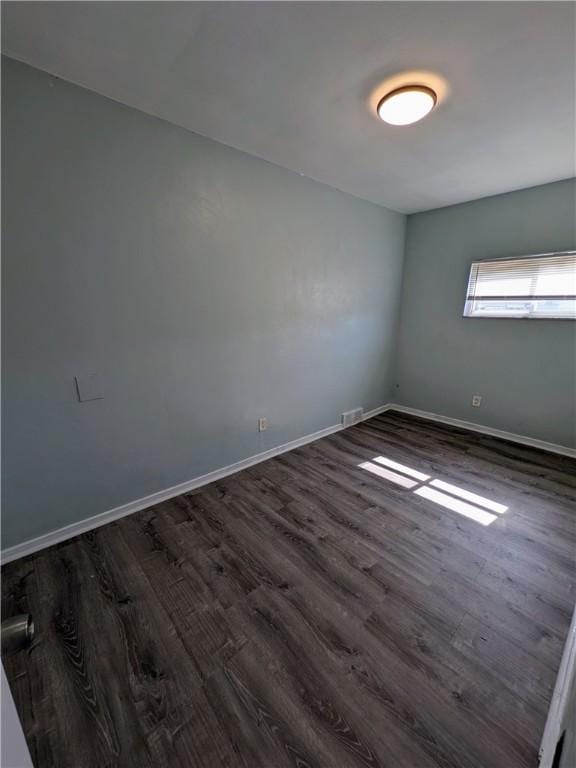 1310 Pirl St, Mckeesport, PA 15132 - spare room with dark wood-style floors