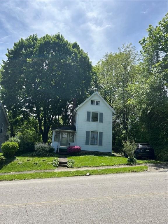 109 W Ridge Ave, Sharpsville, PA 16150 - view of front facade featuring a front yard and a chimney