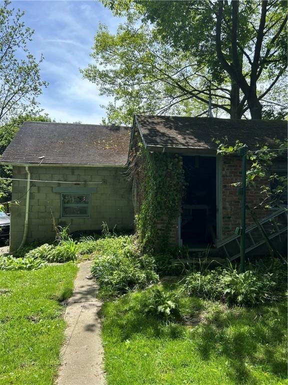 109 W Ridge Ave, Sharpsville, PA 16150 - view of front of property featuring concrete block siding and roof with shingles