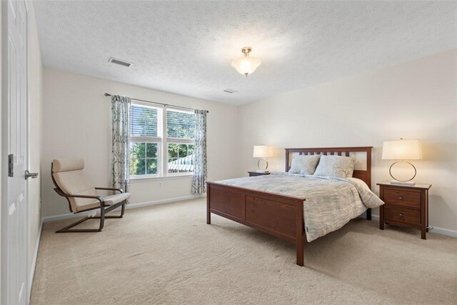 304 Horizon Dr, Monroeville, PA 15146 - carpeted bedroom featuring baseboards and a textured ceiling