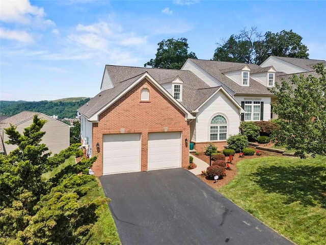 304 Horizon Dr, Monroeville, PA 15146 - view of front of home featuring brick siding, asphalt driveway, an attached garage, and a front yard
