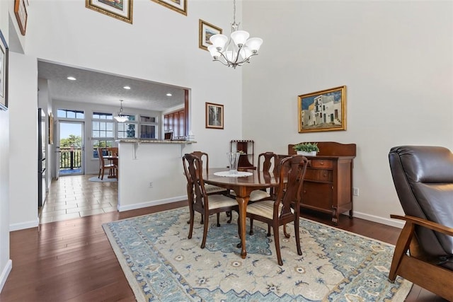 304 Horizon Dr, Monroeville, PA 15146 - dining space featuring a chandelier, wood finished floors, and a towering ceiling