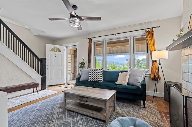 107 Imogene Rd, Greenfield, PA 15217 - living area featuring a ceiling fan, stairs, wood finished floors, and a textured wall
