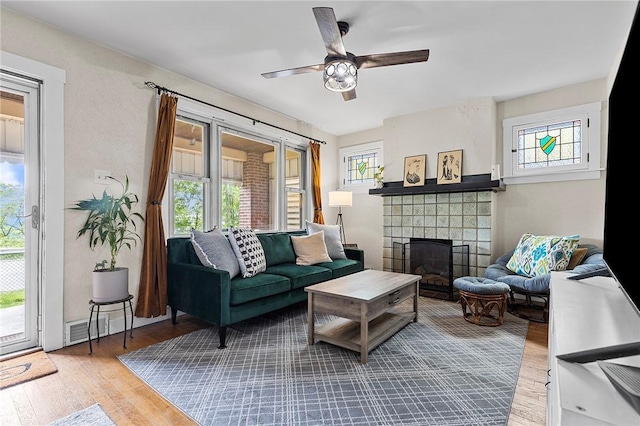 107 Imogene Rd, Greenfield, PA 15217 - living area featuring a fireplace, wood finished floors, and ceiling fan